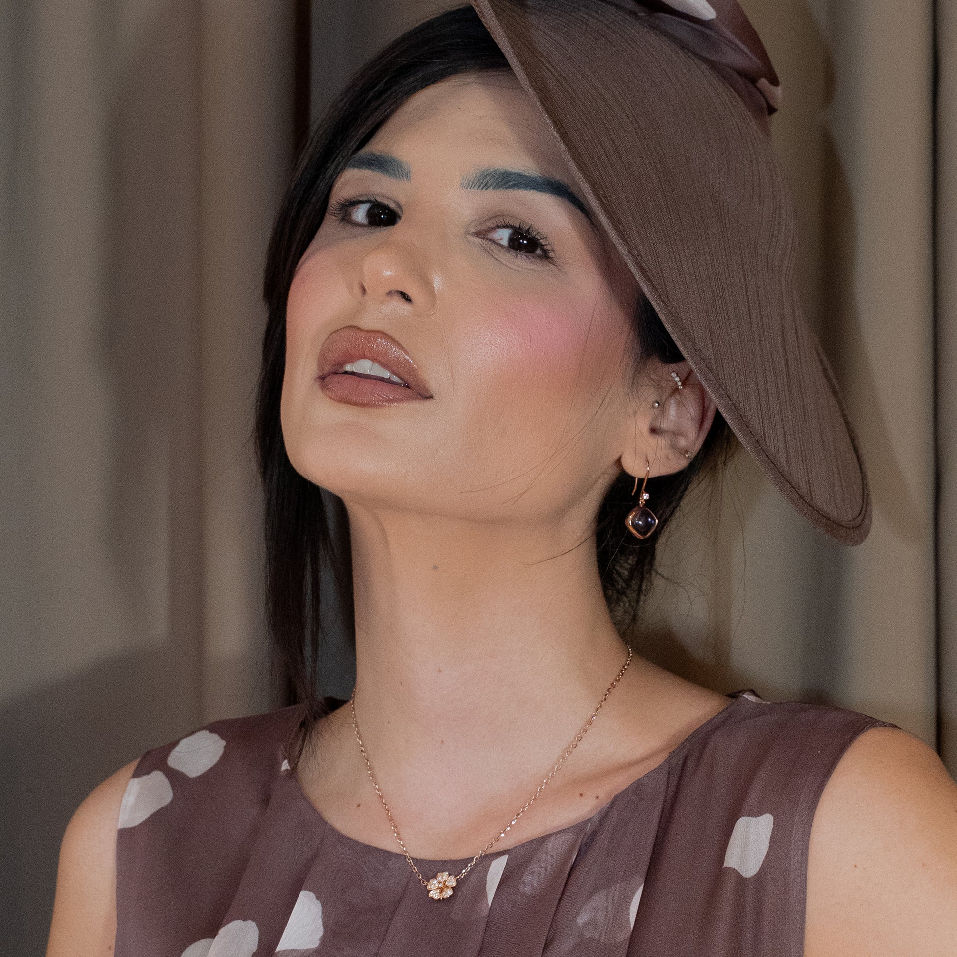 Woman wearing Amethyst Gold Earrings with diamonds.