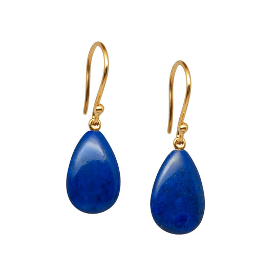 Pair of lapis lazuli gold earrings with blue teardrop stones on a white background