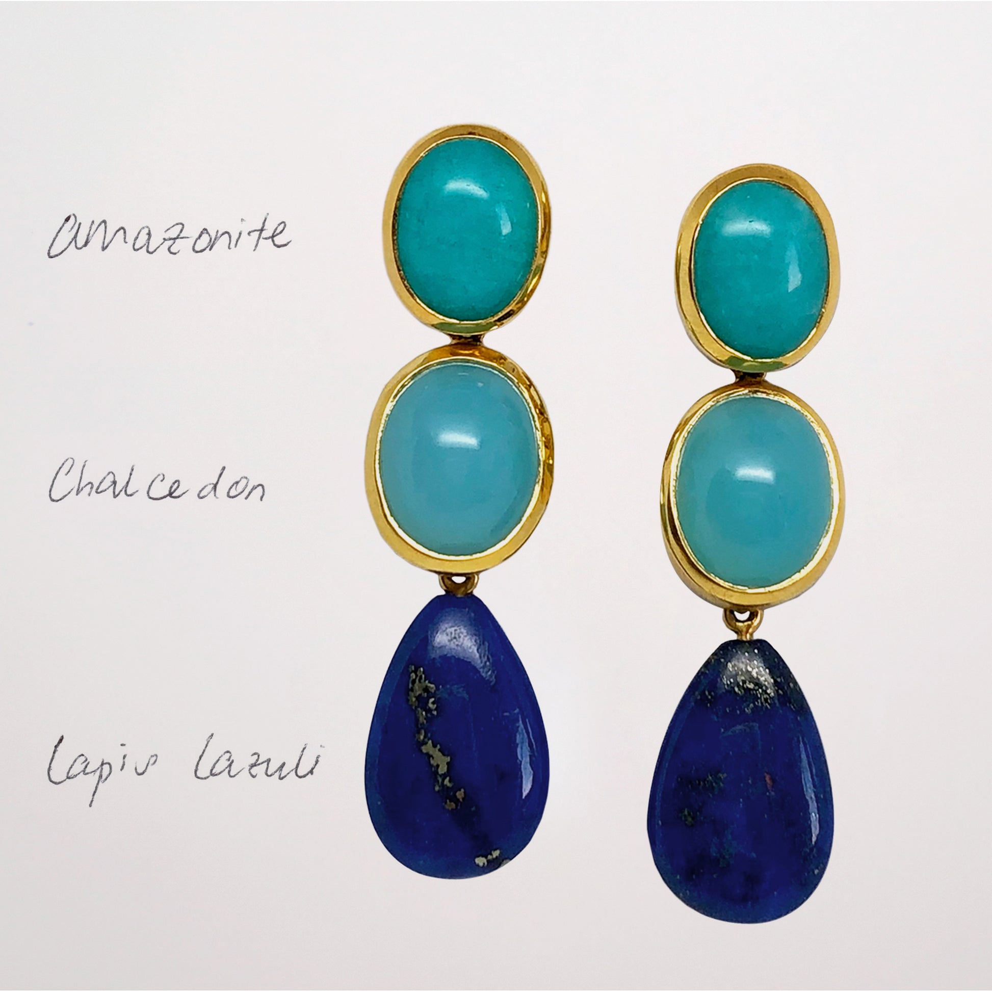 Pair of blue gemstone earrings with turquoise and blue stones on a white background with Amazonite Studs, Chalcedony and Lapis Lazuli
