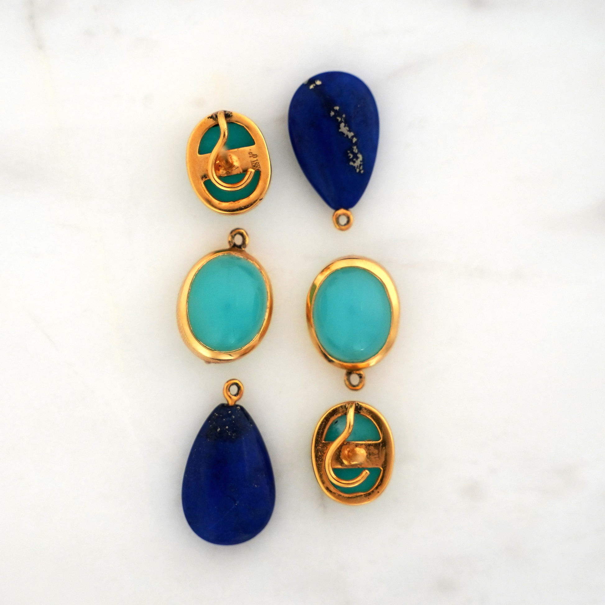 Pair of blue gemstone earrings with turquoise and blue stones on a white background with Amazonite Studs, Chalcedony and Lapis Lazuli